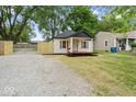 Charming home featuring a quaint front porch and lovely light-colored exterior at 5136 Miller St, Indianapolis, IN 46241