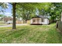 Charming home featuring a quaint front porch and lovely light-colored exterior at 5136 Miller St, Indianapolis, IN 46241
