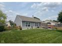 Well-maintained backyard with a privacy fence, landscaping, and a patio area for outdoor enjoyment at 7175 Oakview Dr, Avon, IN 46123