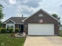 Charming single-story brick home with mature landscaping and a two-car attached garage at 7175 Oakview Dr, Avon, IN 46123
