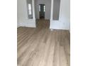 Living room with light wood floors and white trim at 802 N Oakland Ave, Indianapolis, IN 46201