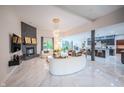 Bright and spacious living room with fireplace, modern furnishings, and open floor plan at 8703 Gordonshire Dr, Indianapolis, IN 46278