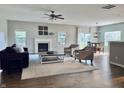 Inviting living room with a fireplace, open layout, and views into the dining area at 1176 Everton Ct, Greenwood, IN 46143