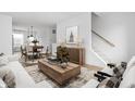 Bright living room with modern furnishings and an open layout, perfect for entertaining and relaxation at 1315 Colere Pl, Indianapolis, IN 46203