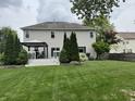 Extensive backyard featuring a manicured lawn, deck area with pergola, and privacy landscaping at 1378 Runningbrook Dr, Avon, IN 46123