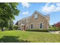 Spacious brick two story home with a manicured lawn and lovely landscape at 16802 Oak Manor Dr, Westfield, IN 46074