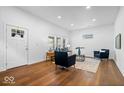 Bright living room with new floors, recessed lighting and stylish furniture at 1709 Fletcher Ave, Indianapolis, IN 46203