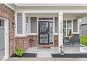 Inviting front porch features rocking chairs, stylish decor, and a charming entrance to the home at 17309 Graley Pl, Westfield, IN 46074