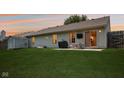 Backyard with a spacious lawn, patio, and a privacy fence at 17357 Austrian Pine Way, Westfield, IN 46074