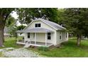 Charming home featuring a covered front porch, well-maintained lawn, and mature landscaping at 204 S Conger St, Saint Paul, IN 47272