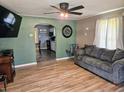 Living room with hardwood flooring, a view into the kitchen and comfortable sofa at 2041 Mckinley Ave, Columbus, IN 47201