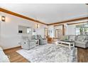 Inviting living room featuring hardwood floors, a cozy seating arrangement, and bright natural light at 2818 Locust Dr, Indianapolis, IN 46227