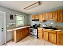 Traditional kitchen featuring oak cabinets, stainless steel appliances, and durable countertops for lasting appeal at 2833 Desoto Way, Columbus, IN 47203