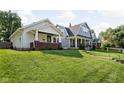 Street view showcases two-story homes with manicured lawns, mature trees, and inviting curb appeal at 4137 Rookwood Ave, Indianapolis, IN 46208