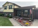 Charming two-story home with brick and siding exterior, landscaped yard, and inviting front porch decor at 4928 Dancer Dr, Indianapolis, IN 46237