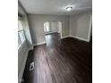 Open-concept living room with new flooring, fresh paint, and abundant natural light at 733 Haugh St, Indianapolis, IN 46222