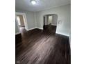 Spacious living room featuring new flooring and fresh paint, creating a welcoming atmosphere at 733 Haugh St, Indianapolis, IN 46222