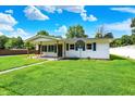 Well-maintained one-story home with a welcoming covered porch, perfect for enjoying the outdoors at 7455 W 700 N, Fairland, IN 46126