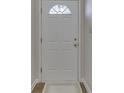 Inviting front door with decorative window and classic design at 824 Ashton Park Dr, Greenwood, IN 46143