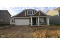 Charming new construction home featuring a covered porch and an attached two-car garage at 10132 Redwood Peak Ln, Indianapolis, IN 46259