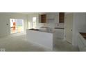 Spacious kitchen with white cabinets, a center island, and ample room for customization at 10132 Redwood Peak Ln, Indianapolis, IN 46259
