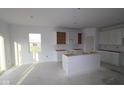 Spacious kitchen with white cabinets, a center island, and ample room for customization at 10132 Redwood Peak Ln, Indianapolis, IN 46259