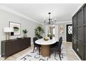 Dining room with modern chandelier, and furniture at 1053 Millwood Ct # 3, Indianapolis, IN 46260