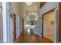 Grand foyer with hardwood floors, staircase, a view of the living room, and high ceilings at 1188 Old Eagle Way, Greenwood, IN 46143