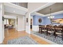 Elegant dining room featuring hardwood floors and decorative lighting fixture at 1313 Brentford Ln, Greenwood, IN 46143