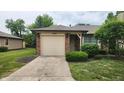 Attractive single-Gathering home boasting an attached garage and meticulously kept front yard at 1836 Queensbridge Cir, Indianapolis, IN 46219