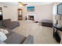 Spacious living room with a brick fireplace, TV, and comfortable gray sectional sofa at 2015 Deer Lake Dr, Martinsville, IN 46151