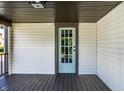 Inviting covered porch with a stylish, glass-paneled front door at 270 W Broadway St, Greenwood, IN 46142