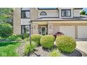 Close up of the charming home showcasing meticulous landscaping and a welcoming entrance at 318 Meadowview Ln, Greenwood, IN 46142