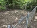 Fenced backyard with room for gardening at 330 S Butler Ave, Indianapolis, IN 46219