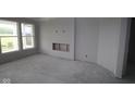Spacious living room with large windows and a fireplace, ready for customization at 3611 Hauser Ct, Bargersville, IN 46106