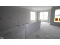 Unfinished living area bathed in natural light with large windows, ready for personalization at 3611 Hauser Ct, Bargersville, IN 46106
