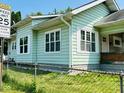 Exterior of a house showing multiple windows, nice siding and a well maintained yard at 547 N Livingston Ave, Indianapolis, IN 46222