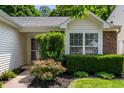 Inviting entrance with well-maintained landscaping, offering a warm welcome to this lovely home at 6963 N Abilene Way, McCordsville, IN 46055