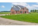 Charming brick home on a spacious lot featuring an attached garage and a well-maintained lawn at 8371 N 400 W, Fairland, IN 46126