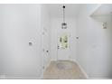 Bright foyer with tile floors, neutral walls, and modern lighting fixtures creating a welcoming entrance at 9363 Hadway Dr, Indianapolis, IN 46256