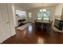 Dining area features hardwood floors, stylish table and chairs, plus a view into the kitchen, and access to the backyard at 9664 Legare St # 2601, Fishers, IN 46038