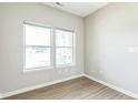 Bright bedroom showcasing hardwood floors, two large windows allowing lots of natural light at 9692 Centennial Ct, Avon, IN 46123