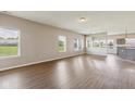 Spacious living room with wood floors and large windows offering lots of natural light at 9692 Centennial Ct, Avon, IN 46123