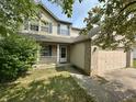 Charming two-story home featuring blue shutters and an attached two car garage at 10832 Tealpoint Dr, Indianapolis, IN 46229