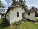 Classic home featuring light yellow siding and a well-maintained lawn at 1201 N Canal St, Alexandria, IN 46001