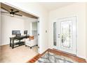 Bright home office with a large window, French door, and a neutral color scheme at 15097 Thoroughbred Dr, Fishers, IN 46040