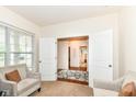 Spacious home office with a view of the hallway, showcasing a neutral color palette at 15097 Thoroughbred Dr, Fishers, IN 46040