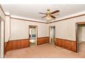 Living room featuring wood trim, and multiple doorways at 2009 S L St, Elwood, IN 46036