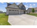 Spacious two-story home boasting a three-car garage, a well-maintained lawn, and charming curb appeal at 221 Underland Cir, Westfield, IN 46074