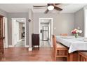 Bright dining room featuring hardwood floors and a stylish table setting at 305 N Warman Ave, Indianapolis, IN 46222